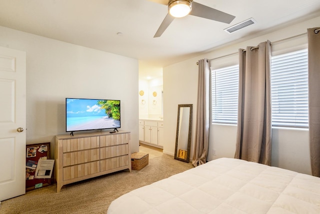 6458 E Riesling Dr, Fresno, CA 93727 - bedroom with light carpet, ensuite bath, and ceiling fan