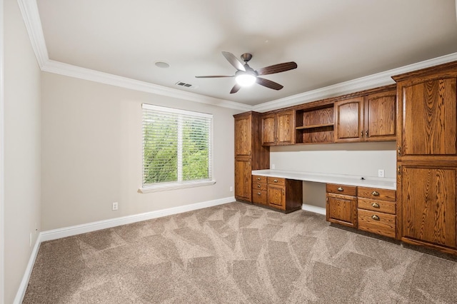 2758 N Highland Ave, Fresno, CA 93737 - unfurnished office with built in study area, ornamental molding, baseboards, ceiling fan, and light carpet
