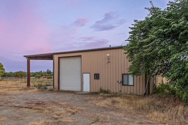 2758 N Highland Ave, Fresno, CA 93737 - garage at dusk featuring a garage