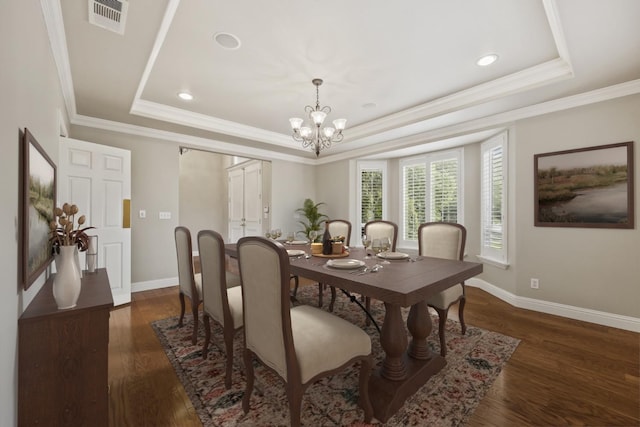 2758 N Highland Ave, Fresno, CA 93737 - dining space with a tray ceiling, a chandelier, baseboards, dark wood finished floors, and ornamental molding