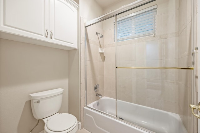 2758 N Highland Ave, Fresno, CA 93737 - full bathroom featuring toilet and bath / shower combo with glass door