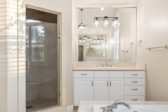 2758 N Highland Ave, Fresno, CA 93737 - bathroom featuring a shower stall, a garden tub, vanity, and a ceiling fan