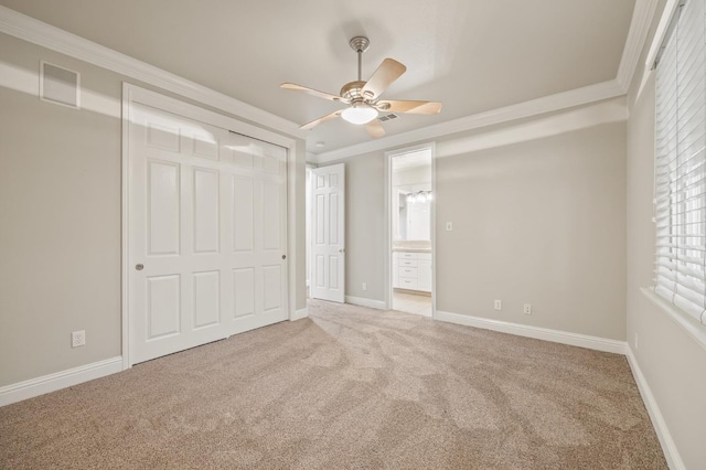 2758 N Highland Ave, Fresno, CA 93737 - unfurnished bedroom featuring carpet flooring, multiple windows, crown molding, and ensuite bathroom