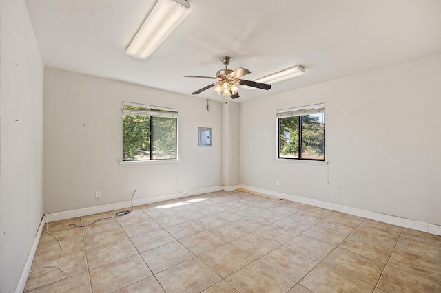 2758 N Highland Ave, Fresno, CA 93737 - unfurnished room featuring light tile patterned flooring, a ceiling fan, and baseboards