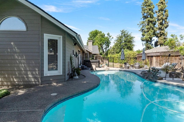 1517 W Fir Ave, Fresno, CA 93711 - view of swimming pool featuring fence, a patio, and a hot tub