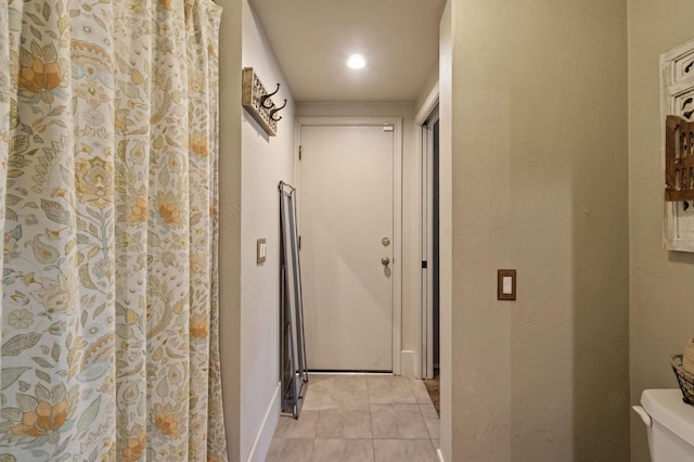1517 W Fir Ave, Fresno, CA 93711 - corridor featuring light tile patterned floors and baseboards