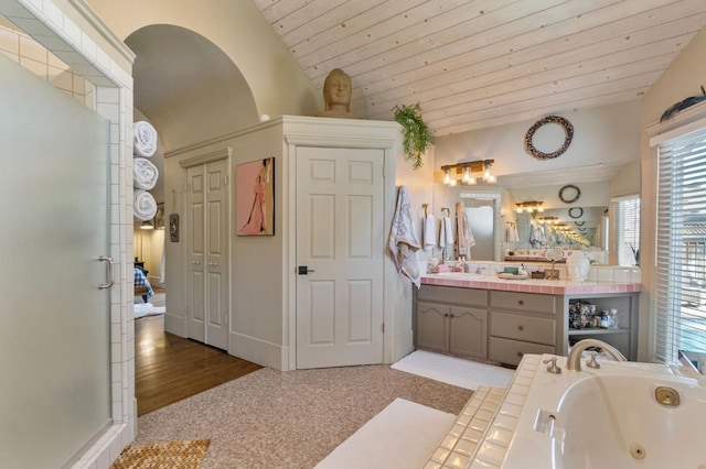 1517 W Fir Ave, Fresno, CA 93711 - bathroom with lofted ceiling, a jetted tub, vanity, wooden ceiling, and a shower stall