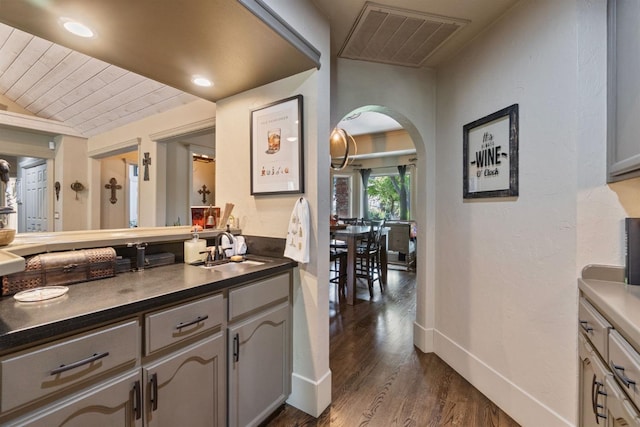 1517 W Fir Ave, Fresno, CA 93711 - bar area featuring a sink, arched walkways, dark wood-type flooring, lofted ceiling, and wooden ceiling