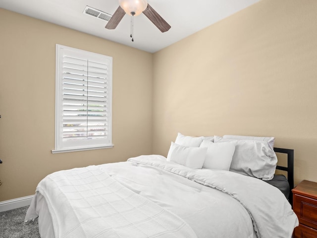 bedroom featuring baseboards, carpet flooring, and a ceiling fan