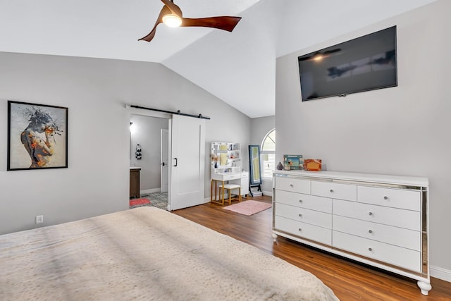 22 Pointe W, Madera, CA 93637 - bedroom with vaulted ceiling, a barn door, wood finished floors, connected bathroom, and ceiling fan