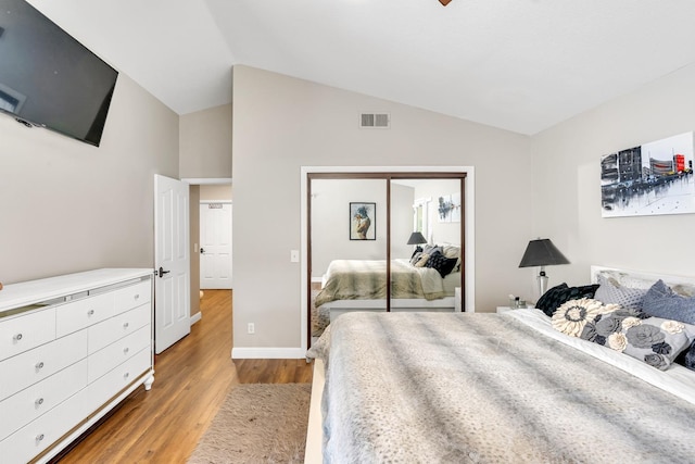 22 Pointe W, Madera, CA 93637 - bedroom with light wood-style flooring, vaulted ceiling, a closet, and baseboards