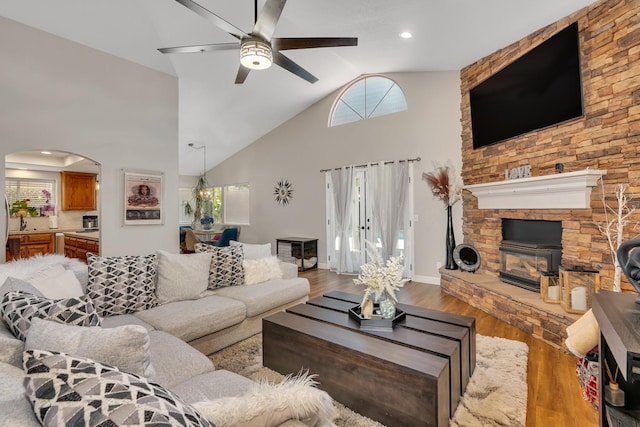 22 Pointe W, Madera, CA 93637 - living room featuring a ceiling fan, wood finished floors, high vaulted ceiling, and arched walkways
