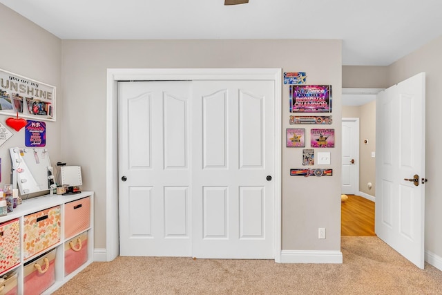 22 Pointe W, Madera, CA 93637 - bedroom with light carpet, a closet, and baseboards