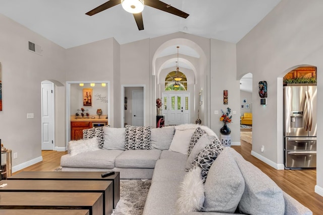22 Pointe W, Madera, CA 93637 - living room with ceiling fan, arched walkways, high vaulted ceiling, light wood finished floors, and baseboards