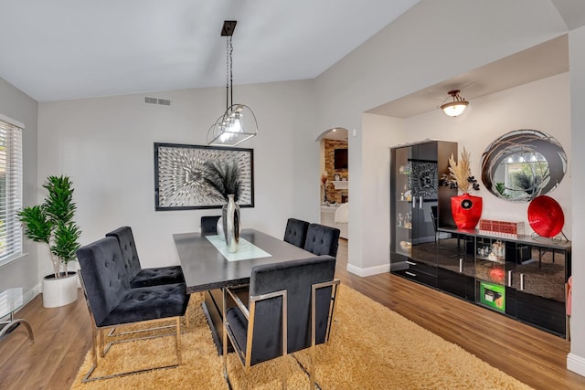 22 Pointe W, Madera, CA 93637 - dining area featuring wood finished floors, arched walkways, and baseboards
