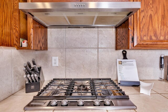 22 Pointe W, Madera, CA 93637 - kitchen with wall chimney range hood and brown cabinetry