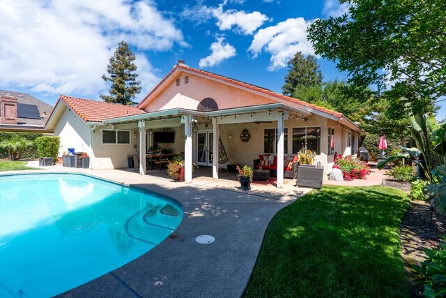 22 Pointe W, Madera, CA 93637 - back of house with stucco siding, a patio area, an outdoor hangout area, and an outdoor pool