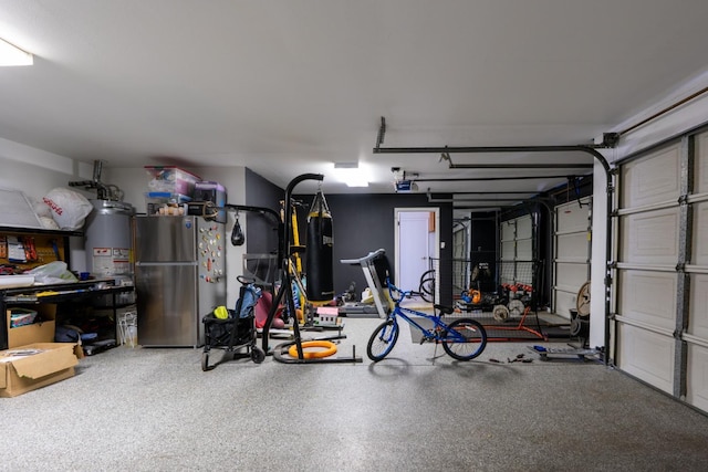 22 Pointe W, Madera, CA 93637 - garage featuring freestanding refrigerator and water heater