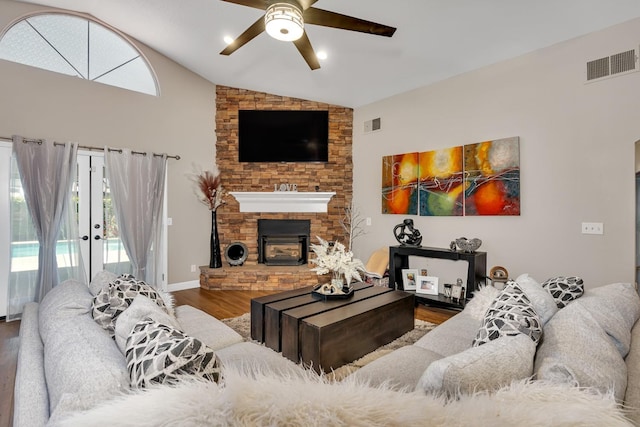 22 Pointe W, Madera, CA 93637 - living room featuring wood finished floors, a ceiling fan, a fireplace, healthy amount of natural light, and high vaulted ceiling
