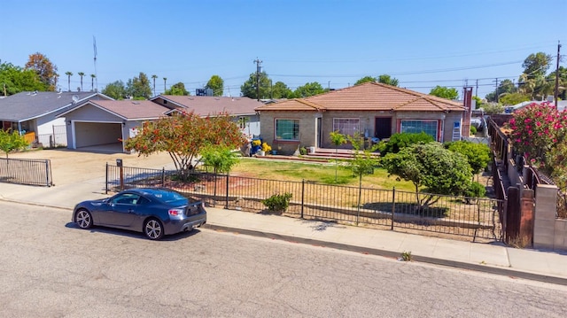 1197 Pucheu St, Mendota, CA 93640 - ranch-style house with driveway, an attached garage, and a tiled roof