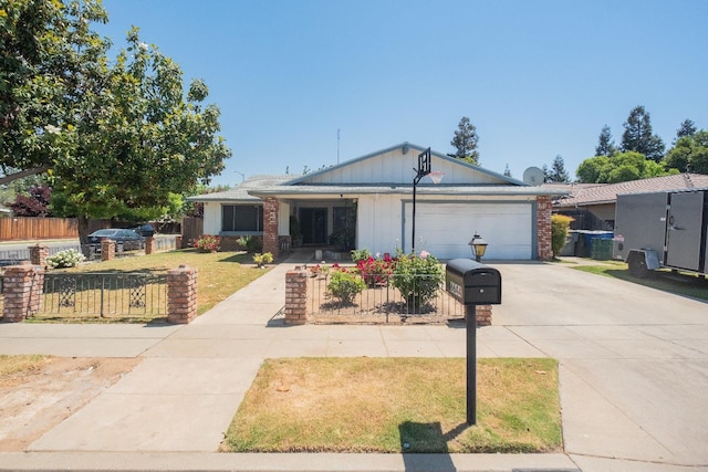 single story home with driveway and an attached garage