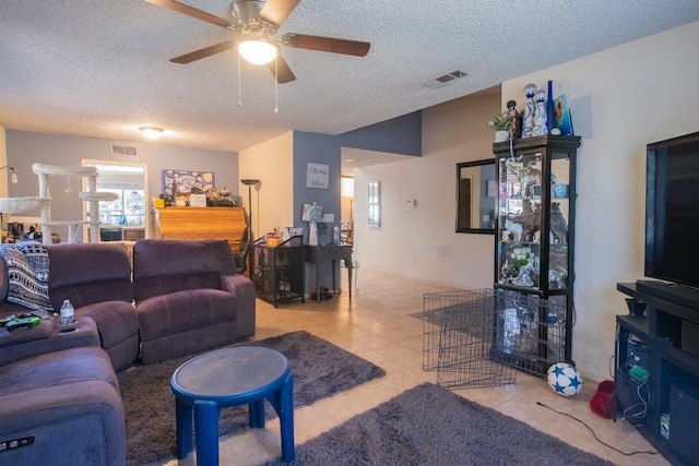 living area featuring a textured ceiling and ceiling fan