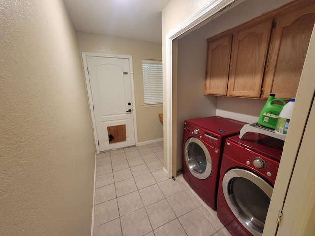 5566 W Fir Ave, Fresno, CA 93722 - washroom with washer and dryer, light tile patterned floors, a textured wall, cabinet space, and baseboards