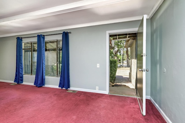 carpeted spare room with baseboards and ornamental molding