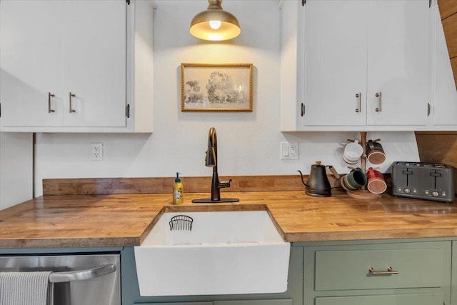 30830 Old Strawberry Rd, Tuolumne, CA 95375 - kitchen with wood counters, a sink, dishwasher, and white cabinets