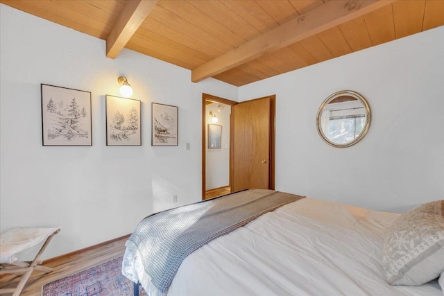 30830 Old Strawberry Rd, Tuolumne, CA 95375 - bedroom featuring wood ceiling, beamed ceiling, and wood finished floors