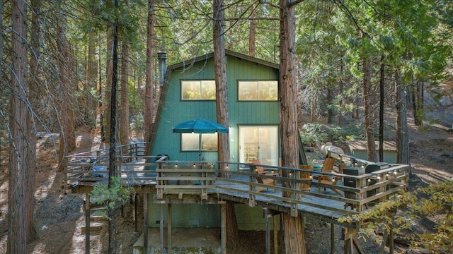30830 Old Strawberry Rd, Tuolumne, CA 95375 - view of front facade featuring a wooden deck and a view of trees