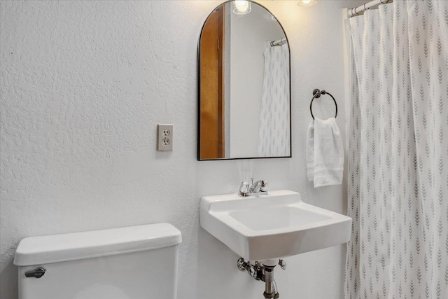 30830 Old Strawberry Rd, Tuolumne, CA 95375 - full bathroom with toilet, a sink, and a shower with shower curtain