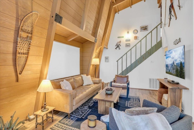 30830 Old Strawberry Rd, Tuolumne, CA 95375 - living room featuring wood finished floors, stairway, beam ceiling, and high vaulted ceiling