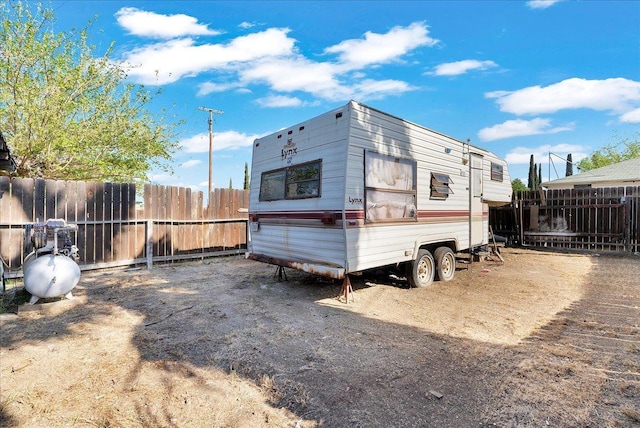 back of property with fence
