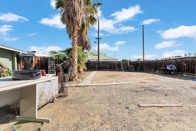fenced backyard featuring a patio