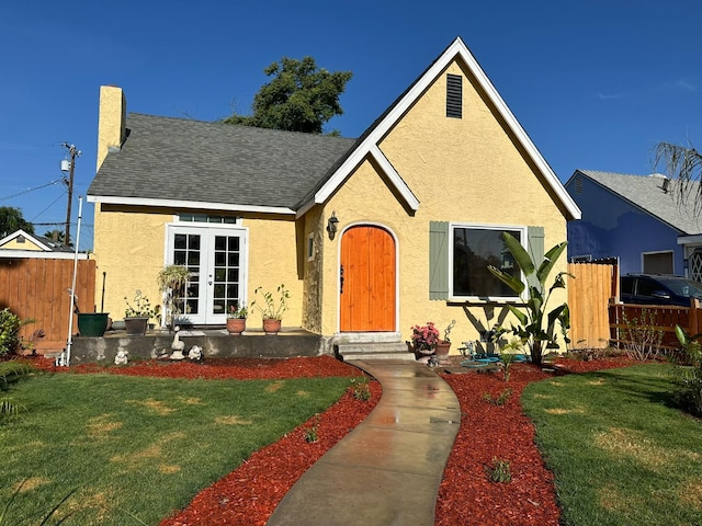 1441 N Calaveras St, Fresno, CA 93728 - view of front of home featuring stucco siding, french doors, a shingled roof, and entry steps