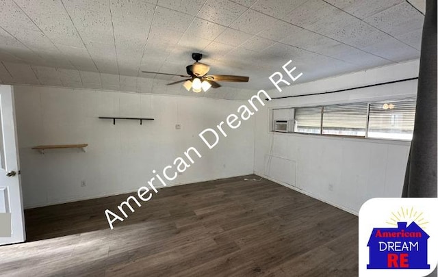 spare room with a ceiling fan and wood finished floors