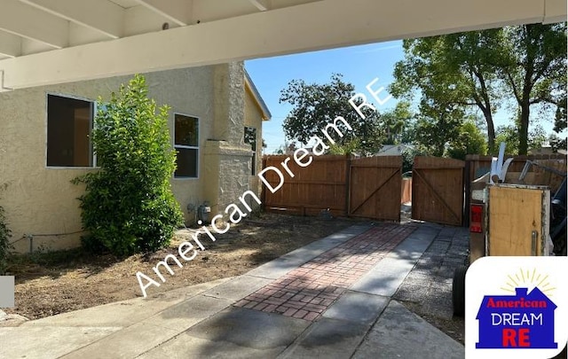 view of patio / terrace featuring a gate and fence