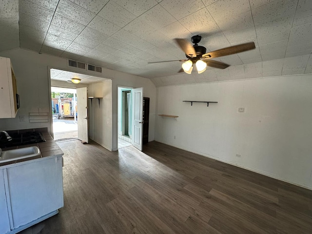1441 N Calaveras St, Fresno, CA 93728 - kitchen with vaulted ceiling, a ceiling fan, and dark wood-style flooring