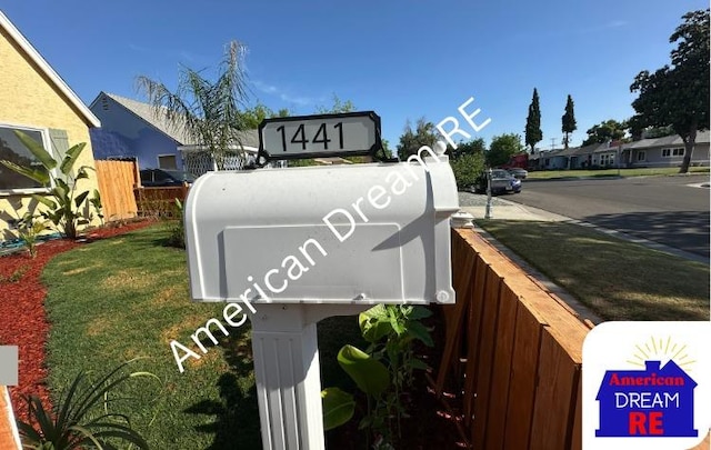community sign featuring fence