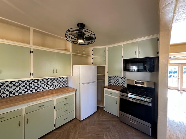1441 N Calaveras St, Fresno, CA 93728 - kitchen featuring black microwave, freestanding refrigerator, stainless steel gas stove, open shelves, and decorative backsplash