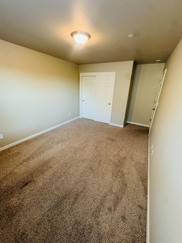 3673 Artistry Way, Clovis, CA 93619 - unfurnished bedroom featuring baseboards, a closet, and carpet