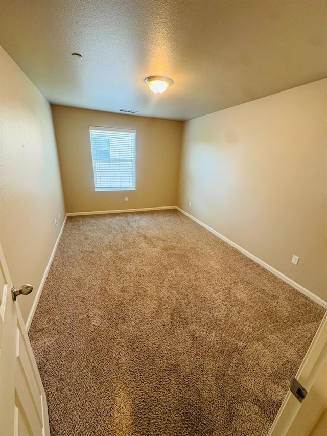 3673 Artistry Way, Clovis, CA 93619 - spare room with carpet floors, baseboards, and a textured ceiling
