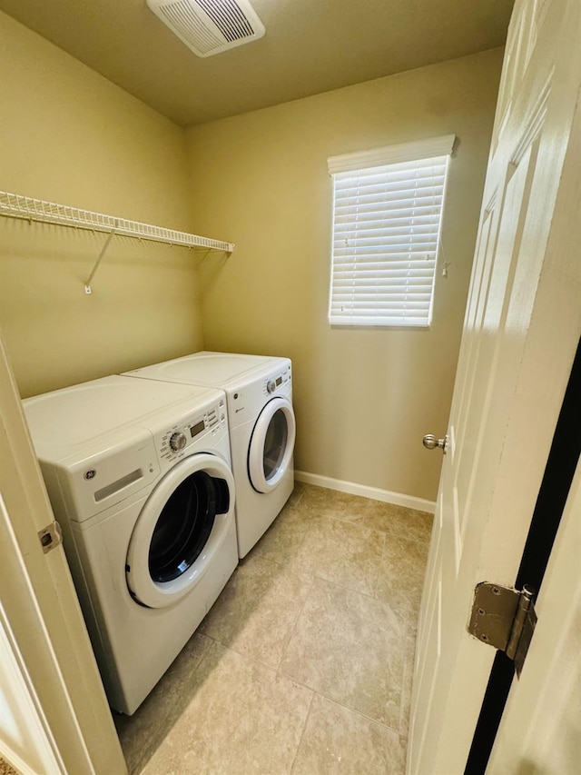 3673 Artistry Way, Clovis, CA 93619 - laundry room featuring separate washer and dryer, baseboards, and light tile patterned floors