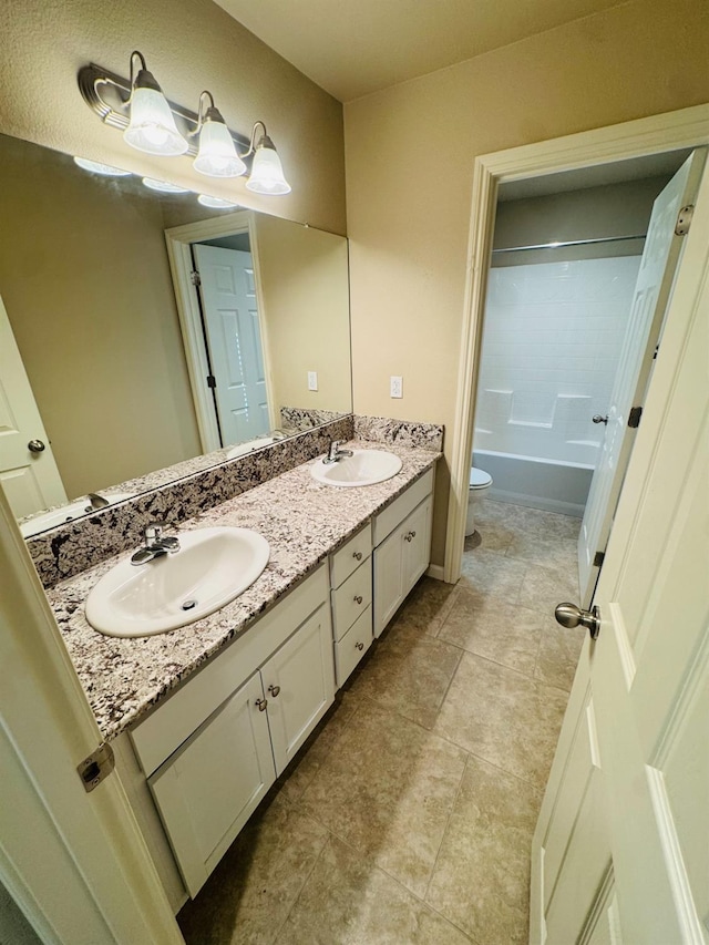 3673 Artistry Way, Clovis, CA 93619 - bathroom with toilet, double vanity, and tub / shower combination