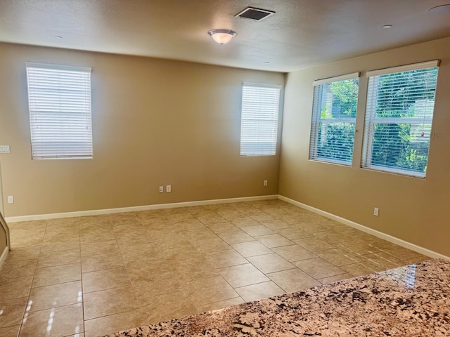 3673 Artistry Way, Clovis, CA 93619 - empty room with light tile patterned floors and baseboards