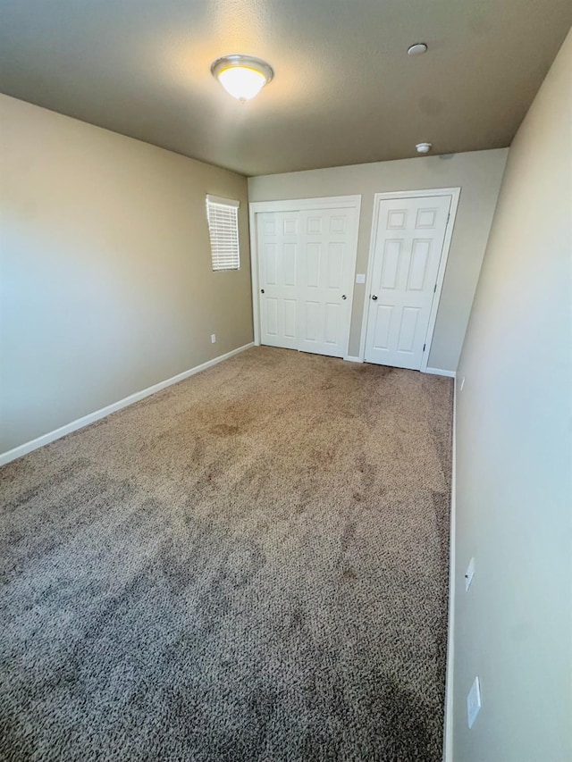 3673 Artistry Way, Clovis, CA 93619 - unfurnished bedroom with baseboards, a closet, and carpet flooring