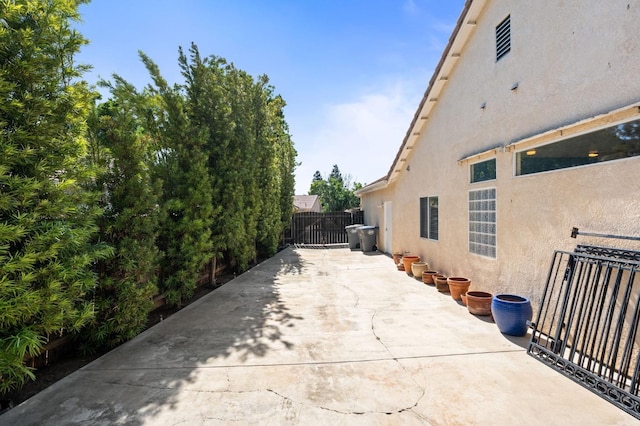 10597 E Fieldstone Ave, Clovis, CA 93619 - view of property exterior with stucco siding and fence