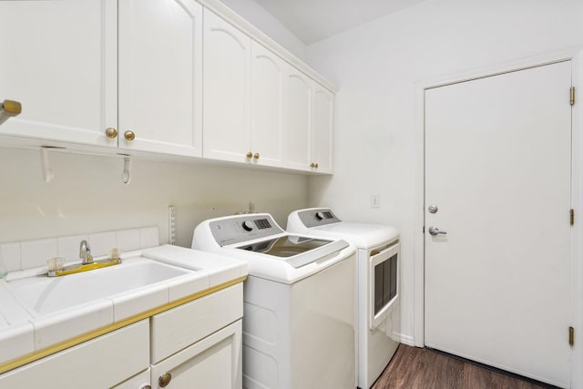 10597 E Fieldstone Ave, Clovis, CA 93619 - laundry area with washing machine and clothes dryer, cabinet space, and dark wood-style floors