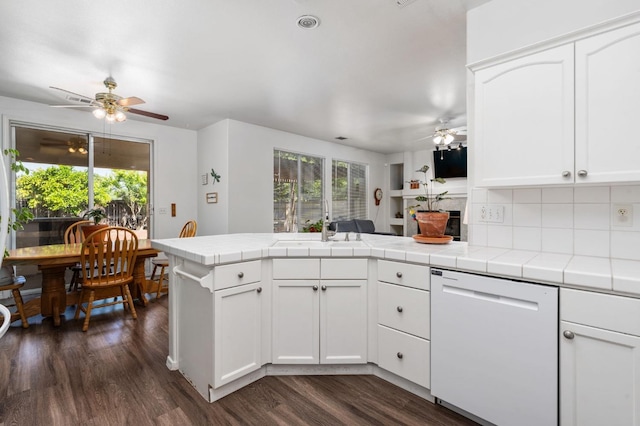 10597 E Fieldstone Ave, Clovis, CA 93619 - kitchen featuring white dishwasher, ceiling fan, plenty of natural light, and a peninsula
